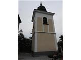 Obnovljen zvonik je ločen od cerkvice .Že Valvazor je pisal , tu vmes potek meja med Štajersko in Koroško